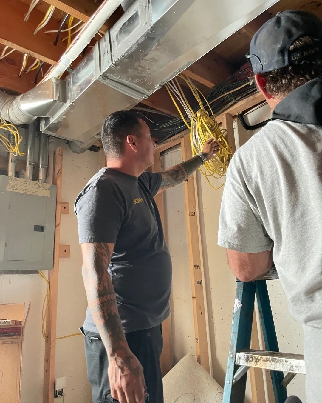 Beaver Services techs working on heating system