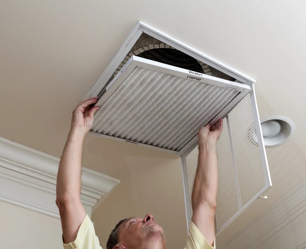 Man changing an air filter