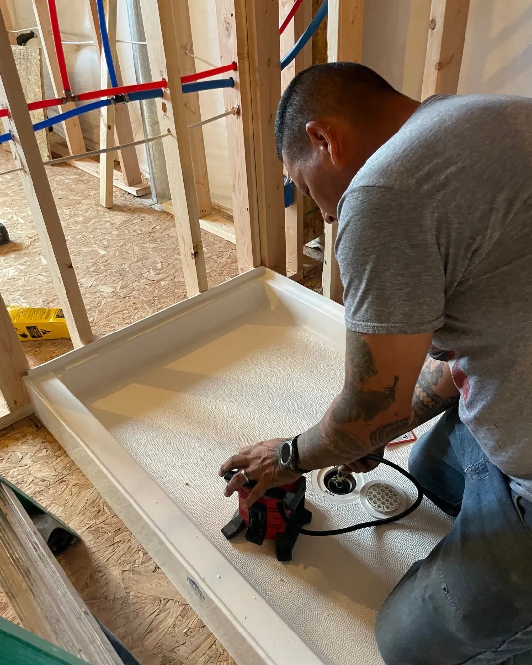 Beaver Services tech working on plumbing