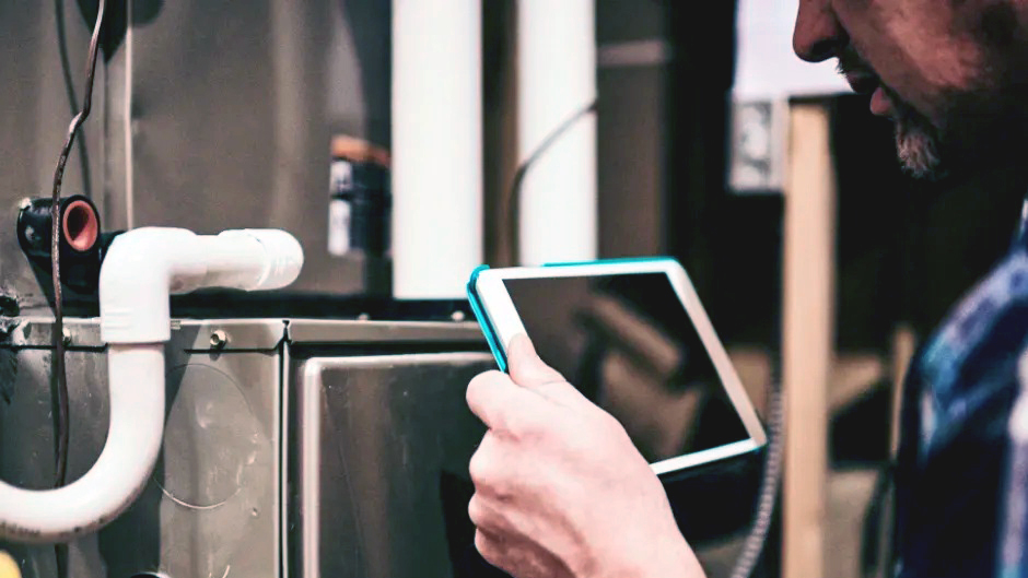 A tech checking a boiler